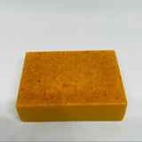 Orange rectangular sponge on a white background