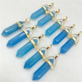 Blue crystal pendants with gold accents on a white background