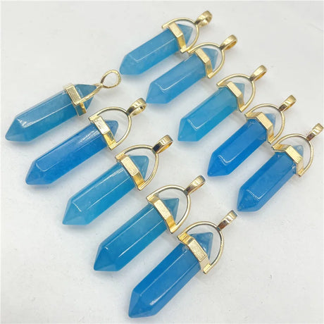 Blue crystal pendants with gold accents on a white background