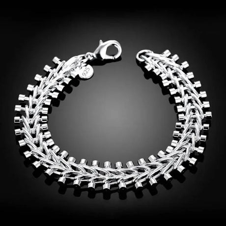 Silver bracelet on a black background