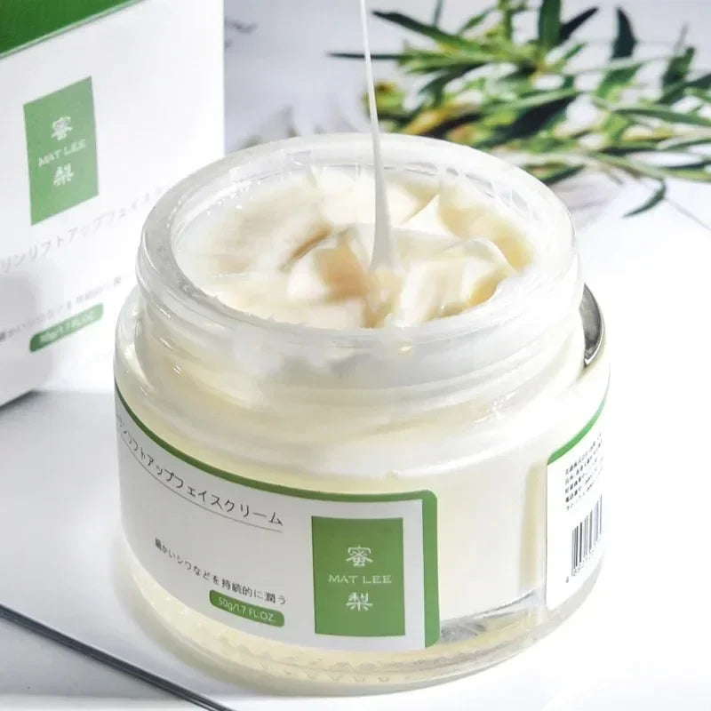 Jar of cream with a green label on a white background