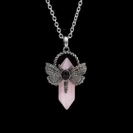 Jewelry necklace with a dragonfly pendant and pink crystal on a black background