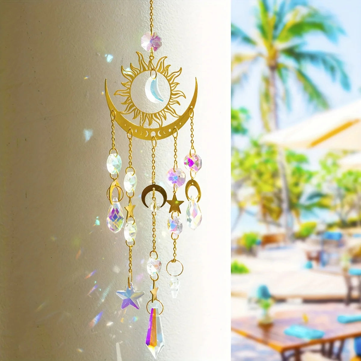 Decorative hanging ornament with celestial design on a plain background