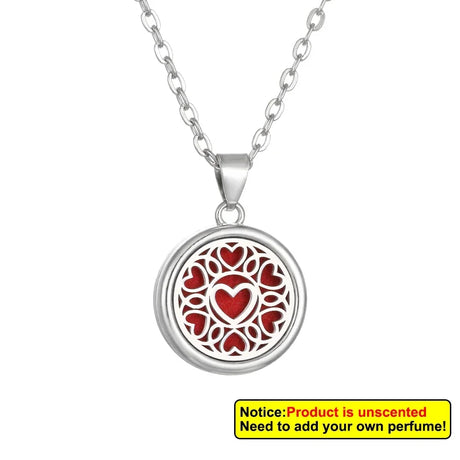 Silver necklace with a red heart pendant on a white background