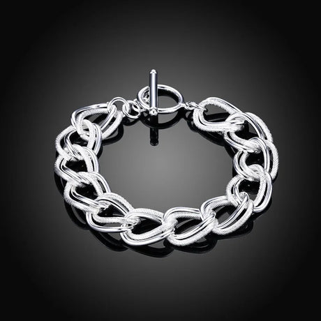 Silver chain bracelet on a black background
