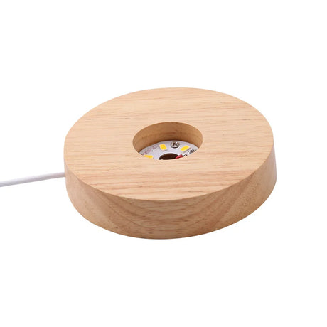 Wooden spool with a central hole on a white background