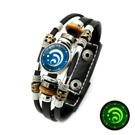 Glowing bracelet with blue circular design and black leather strap on a white background