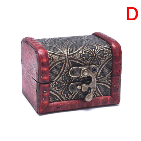 Decorative jewelry box with intricate patterns and a latch on a white background