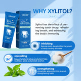 GROEI Xylitol toothpaste packaging with benefits listed on a blue background