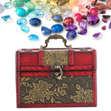 Decorative jewelry box with floral patterns and colorful gemstones on a white background