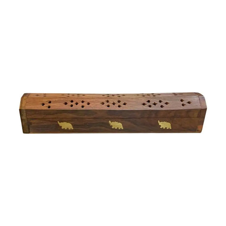 Wooden incense holder with elephant designs on a white background