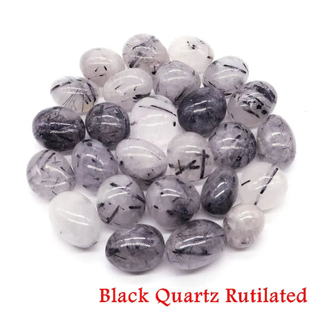 Collection of Black Quartz Rutilated stones on a white background