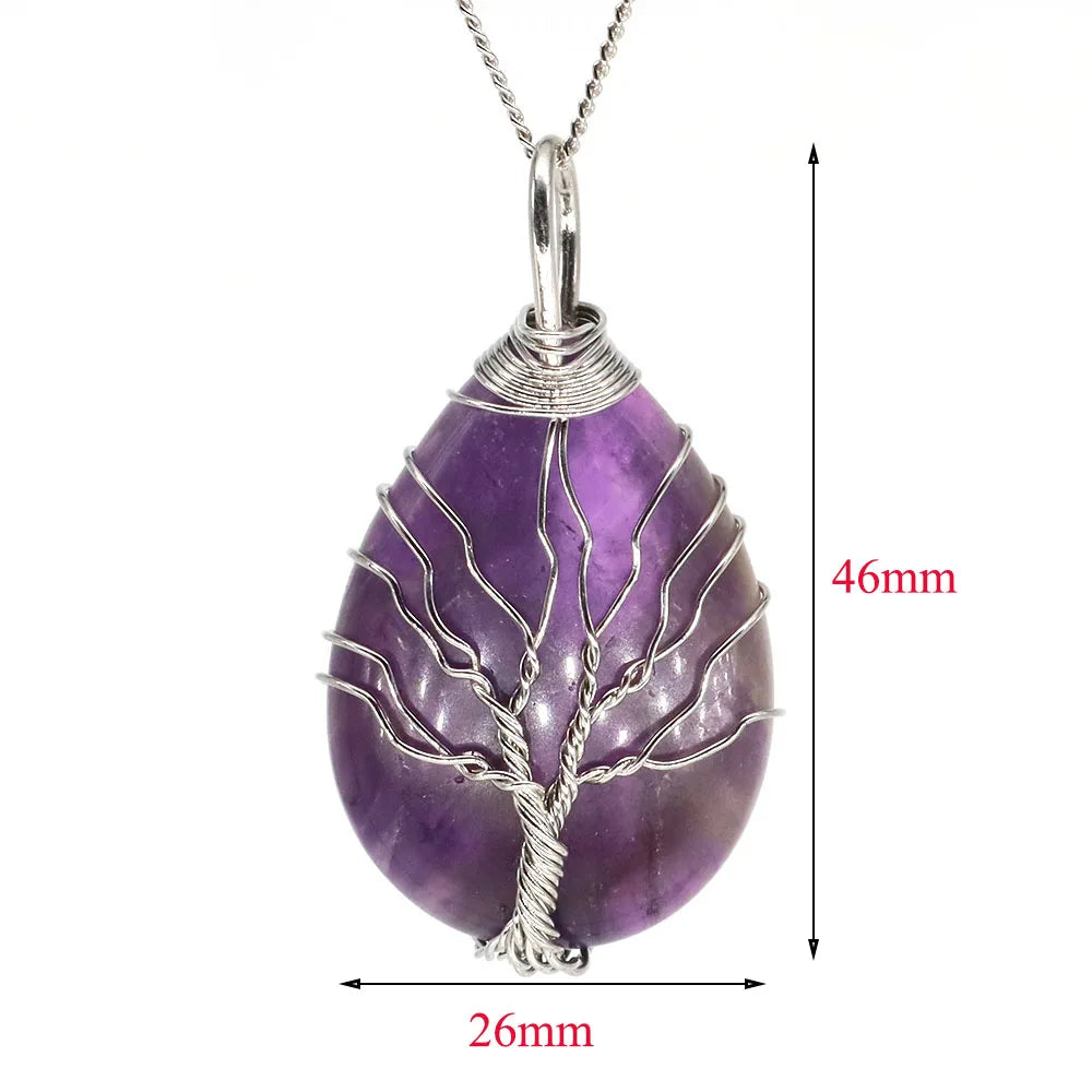 Purple tree-shaped pendant with silver wire wrapping on a white background