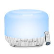 Aromatherapy diffuser with a wooden texture base and remote control on a white background