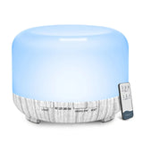 Aromatherapy diffuser with a wooden texture base and remote control on a white background