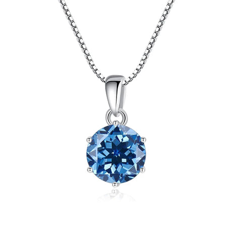 Blue gemstone pendant on a silver chain against a white background