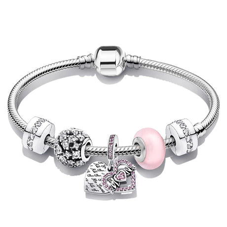 Silver bracelet with heart-shaped charm and pink bead on a white background