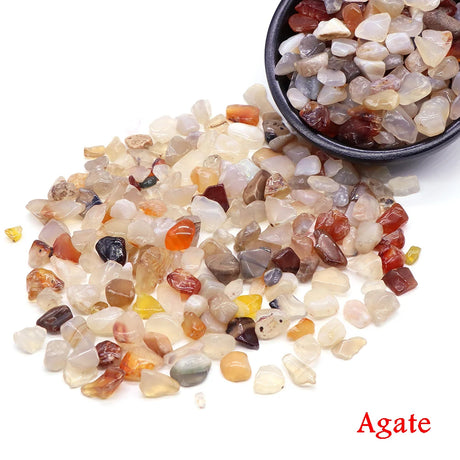 Agate stones with a bowl of rocks on a white background. 
