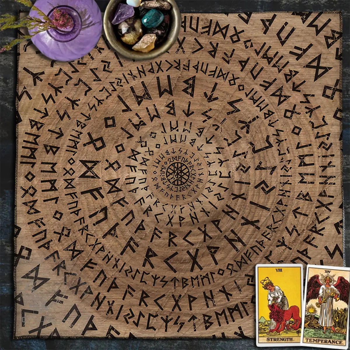 Wooden surface with engraved symbols, tarot cards, and crystals on a dark background