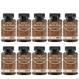 Multiple bottles of Zynera Black Maca capsules on a white background