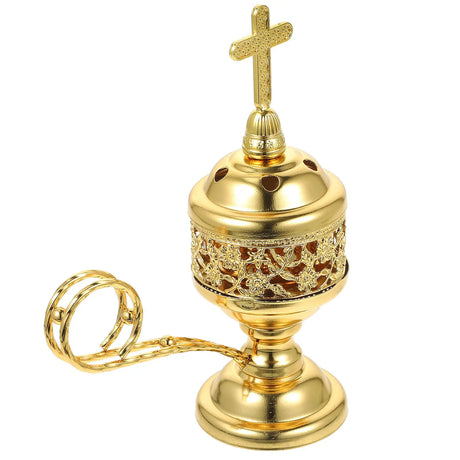 Gold censer with cross on top on a white background