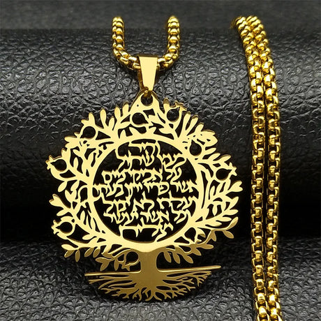 Gold tree-shaped pendant with intricate design on a black textured background
