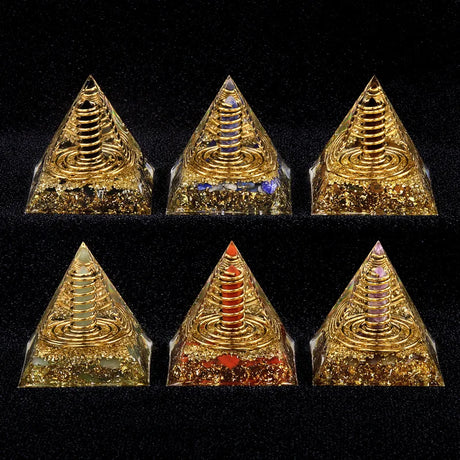 Set of six gold pyramid-shaped objects on a black background