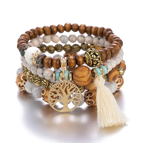 Stack of beaded bracelets with decorative elements on a white background