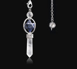 Crystal pendant necklace with silver chain on a black background