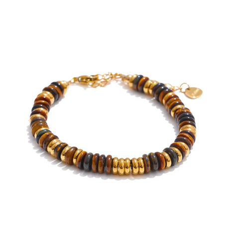 Bracelet with wooden beads and gold accents on a white background
