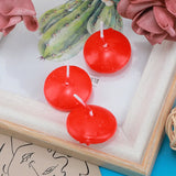 Three red floating candles on a white surface with a cactus illustration in the background.