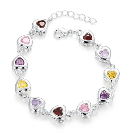 Silver bracelet with heart-shaped gemstones on a white background