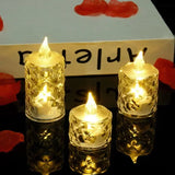 Set of four glowing candles on a reflective surface with a blurred background