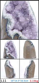 Geode with purple crystal interior on a white background