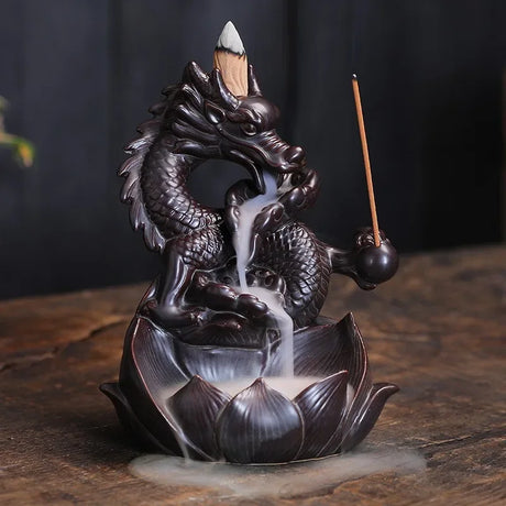 Dragon-shaped incense burner with incense sticks on a dark background