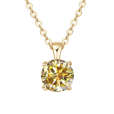 Gold necklace with a yellow gemstone pendant on a white background