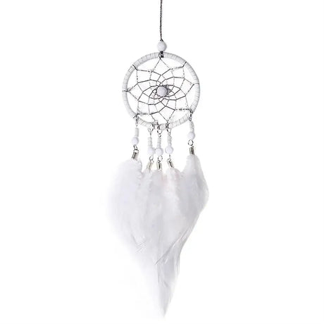 White dreamcatcher with feathers on a white background