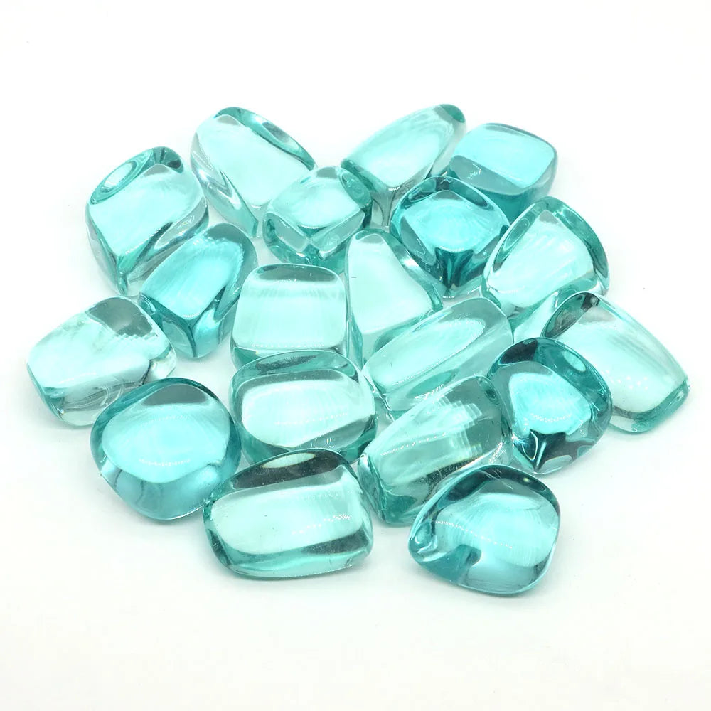 Turquoise glass gems on a white background