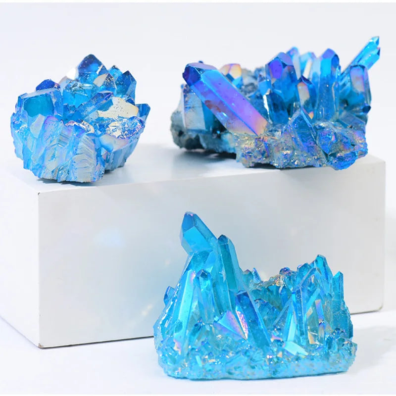 Three blue crystal-like structures on a white platform
