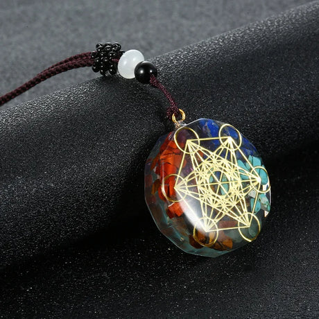 Decorative pendant with intricate design on a dark surface