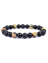 Beaded bracelet with black, brown, and green stones on a white background
