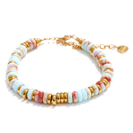 Multicolored beaded bracelet with gold accents on a white background
