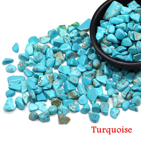 Turquoise stones with a bowl on a white background
