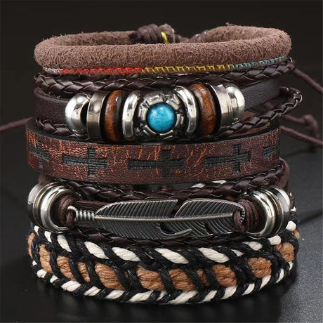 Stack of leather bracelets with metal accents on a dark background