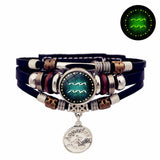 Multistrand bracelet with Aquarius symbol charm on a white background