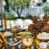 Ceremonial offering table with food and offerings outdoors