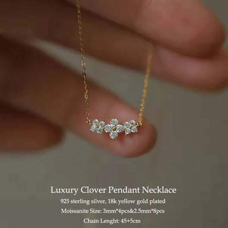 Luxury clover pendant necklace on a blurred background