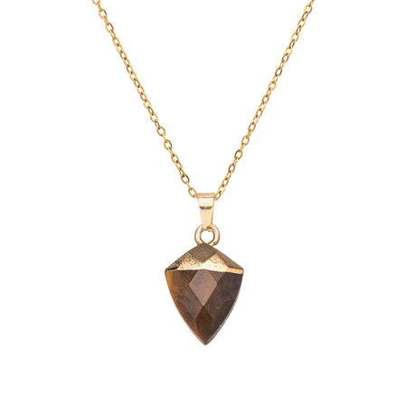 Gold necklace with a faceted pendant on a white background
