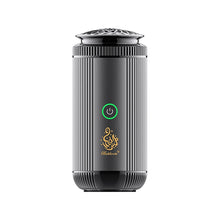 Black air diffuser with a green power indicator on a white background