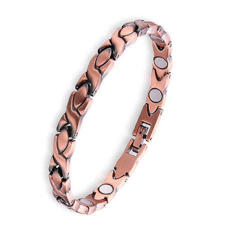 Rose gold bracelet with magnetic elements on a white background